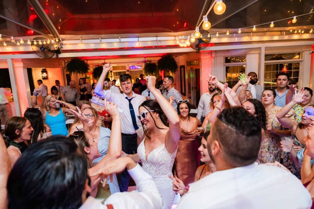 bride is enjoying dancing on the lit-up dance floor during her wedding reception captured by Georgia Southeast wedding photographer Peach State Weddings