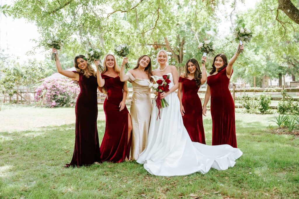 Lucy and her Bridesmaids cheering group shot captured by Atlanta Wedding photographer Peach State Weddings in Lakeland Florida