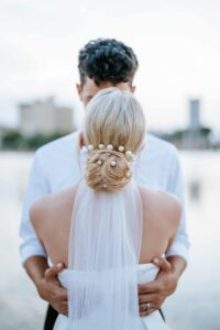 Bride and Groom portrait at Lake Mirror adjacent from the Magnolia Building wedding venue in Lakeland, Florida.