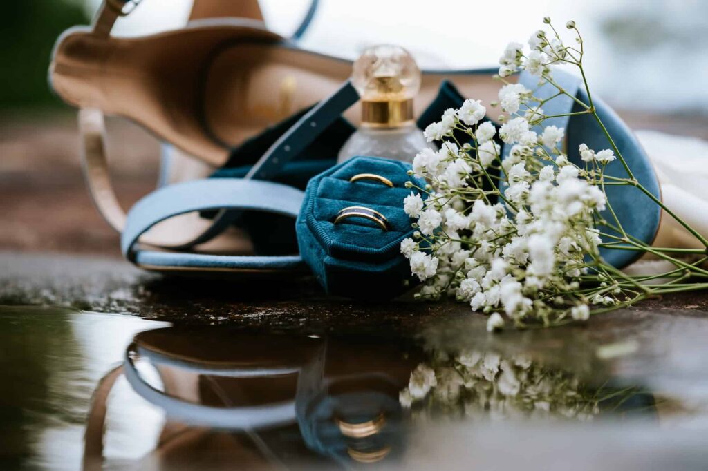 Portfolio 5 Photo of the wedding details, including rings, her shoes and perfume from a wedding at Terra Incognita Vineyard wedding venue