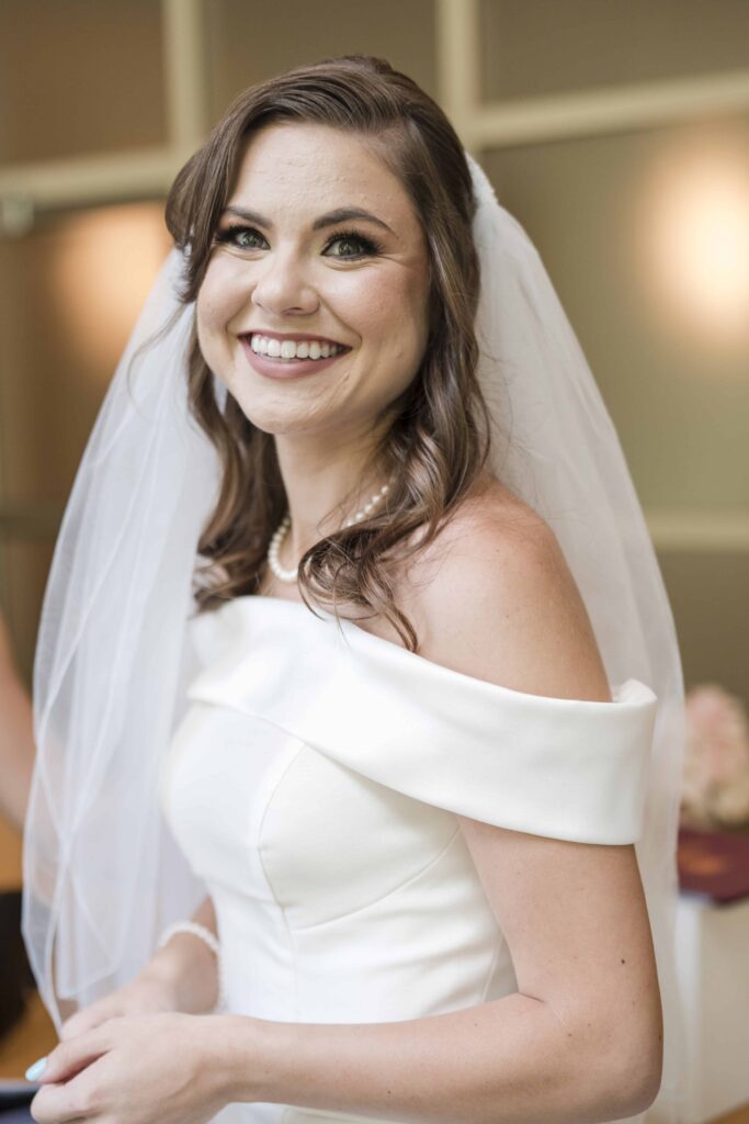 Atlanta photographer captures candid shot of bride during getting ready at the Fernbank wedding venue in Atlanta
