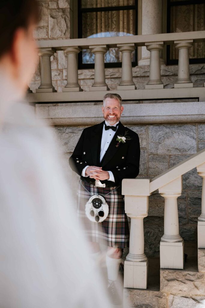 Detailed shot of a groom’s sporran and kilt pin during a traditional Scottish wedding in Georgia.