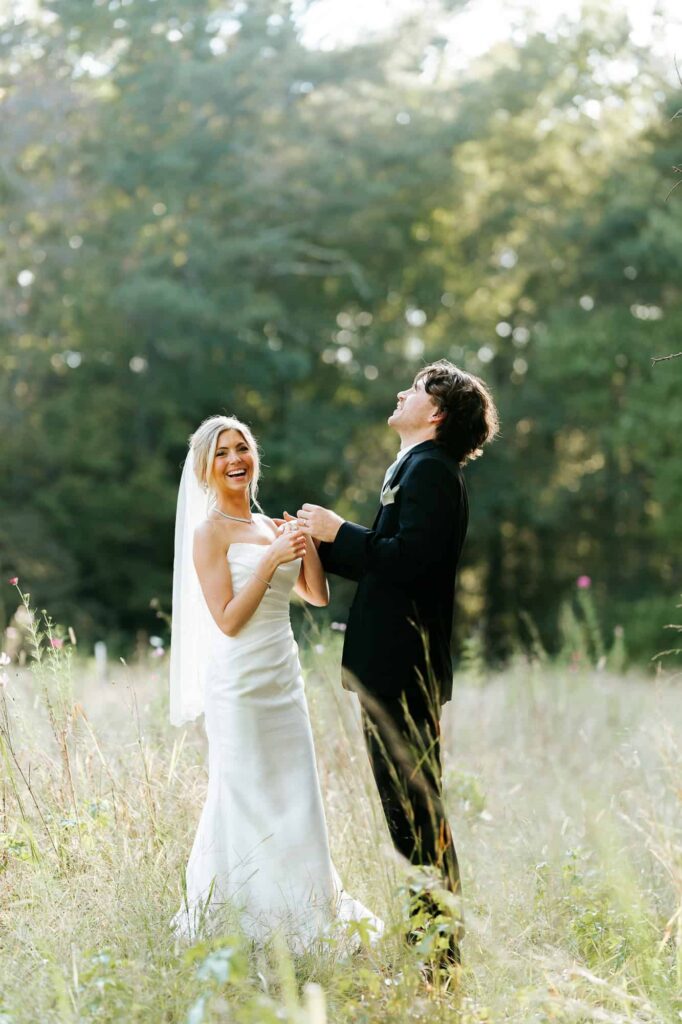 Couple having a candid moment, laughing during sunset portrait session at the Venue at Daisy Hill