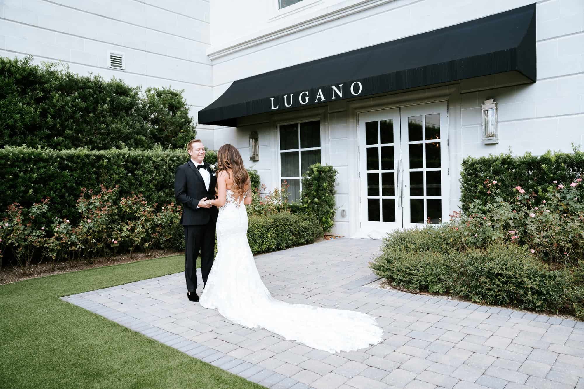 Groom turning to see his bride for the first time in the World Equestrian Center rose garden, photographed by Atlanta Georgia based Peach State Weddings.
