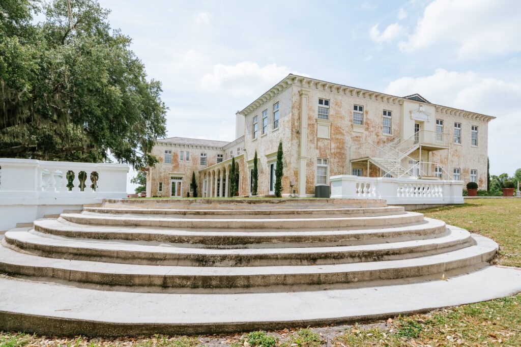 Bella Cosa wedding venue with curved stone steps leading to the historic estate’s rear façade, ideal for outdoor ceremonies or grand entrances