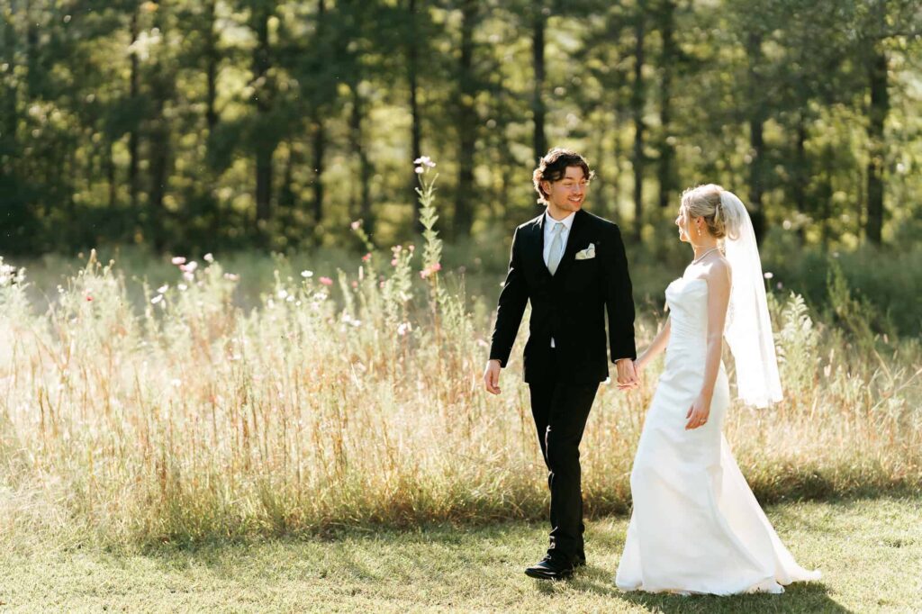 Golden hour wedding portraits of Hannah and Zach at The Venue at Daisy Hill, featuring the soft sunset light through Georgia pines.